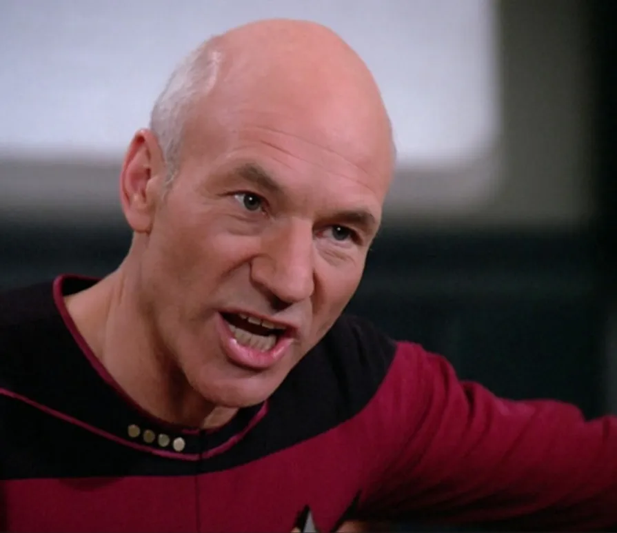 Picard, mid-argument, gesturing as he makes his case in "The Measure of a Man".