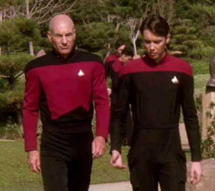 Picard and Wesley walking through the Starfleet Academy grounds in "The First Duty".