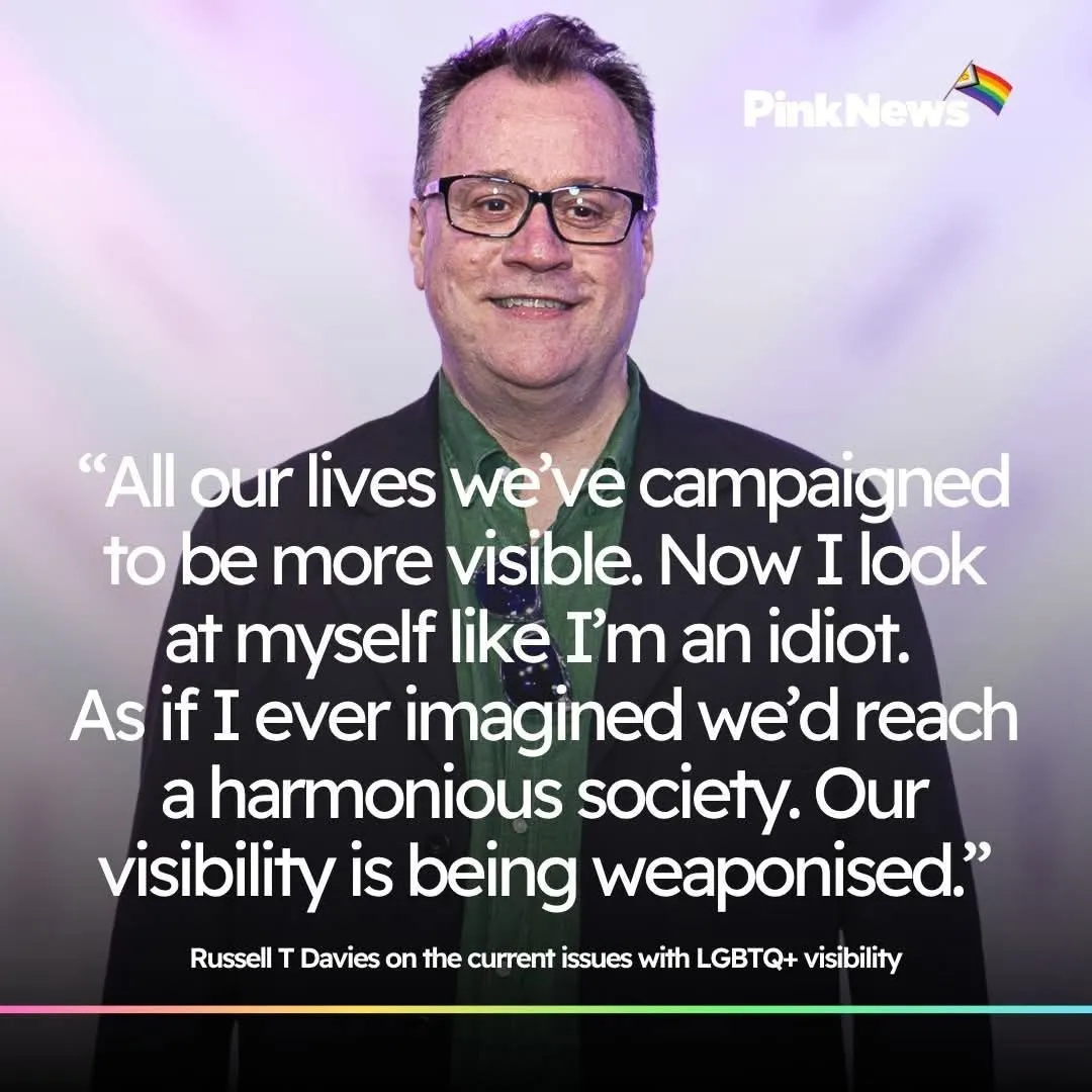 PinkNews quote graphic of Russell T Davies, smiling, in a dark jacket and green shirt. Quote: "All our lives we've campaigned to be more visible. Now I look at myself like I'm an idiot. As if I ever imagined we'd reach a harmonious society. Our visibility is being weaponised." Caption: Russell T Davies on the current issues with LGBTQ+ visibility.