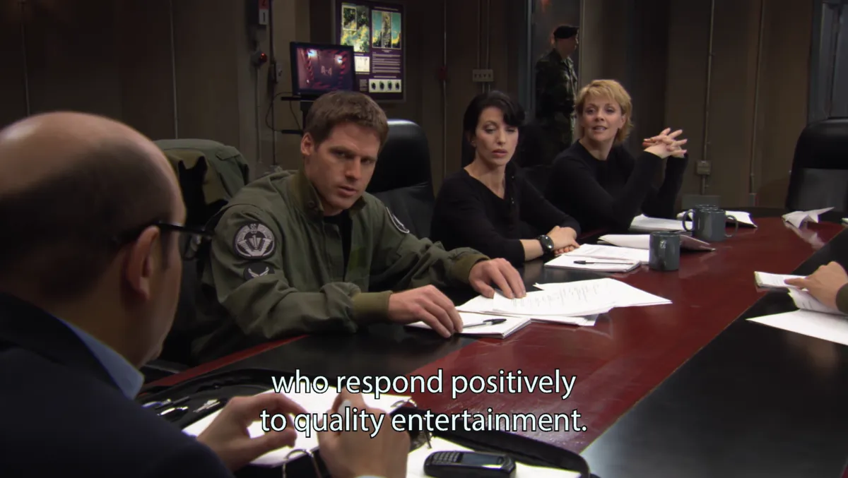 The same table, Carter now smiling. Subtitle: "who respond positively to quality entertainment."